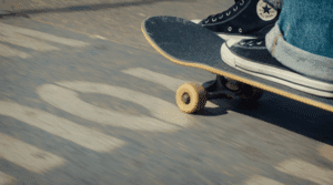 Tony Marchena kick-pushing his skateboard